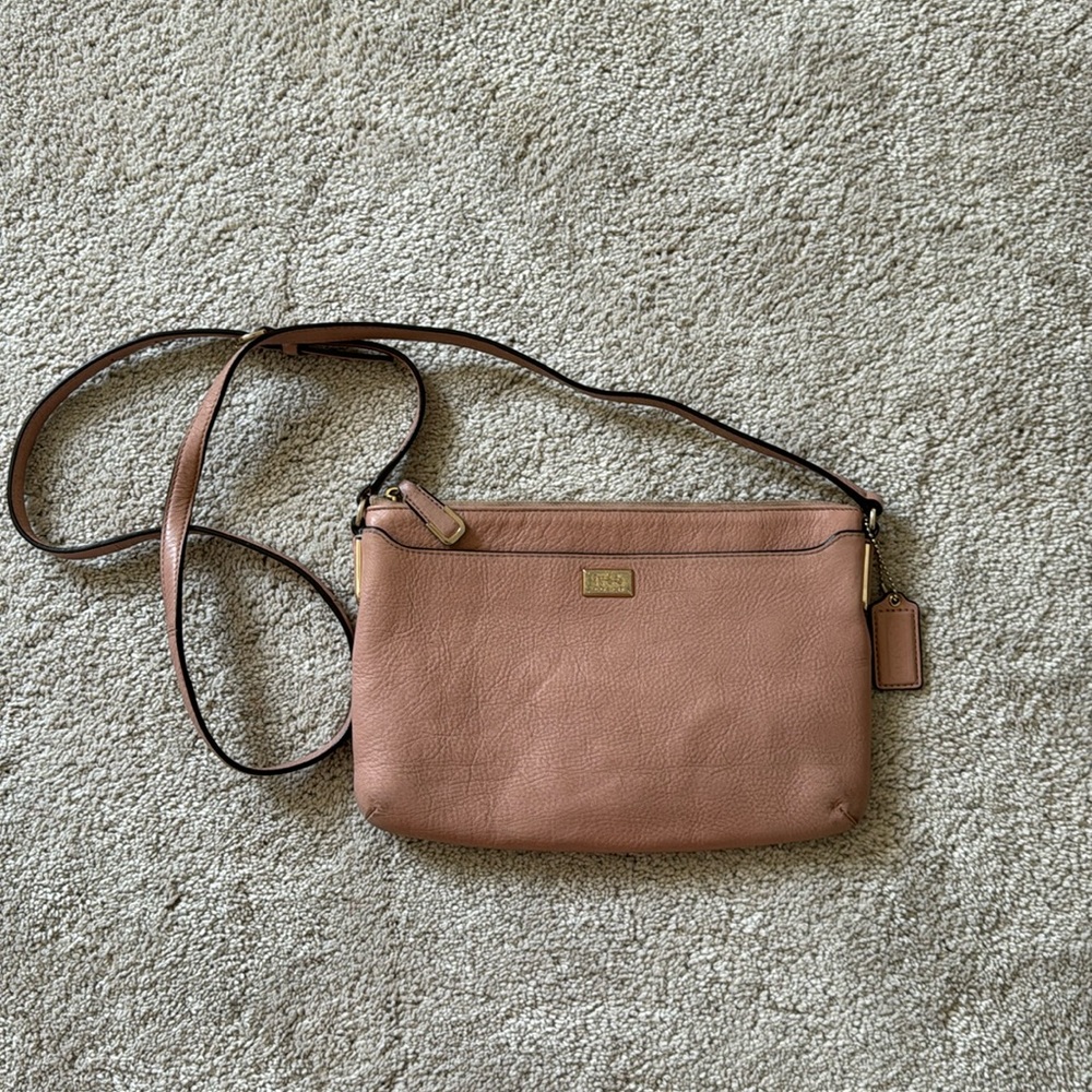 Used Coach Carriage Crossbody Bag. Please see pictures of wear.